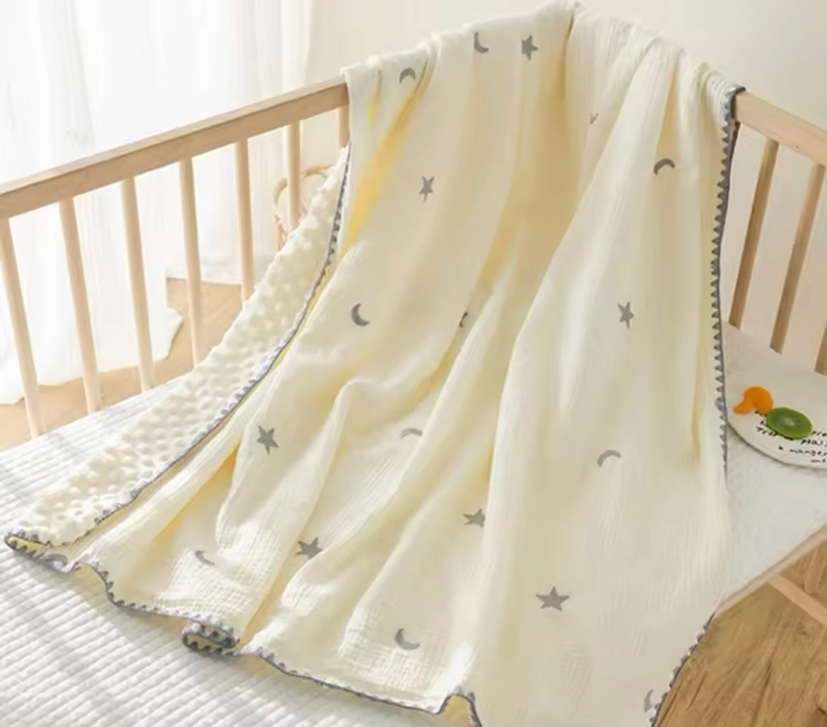 Manta de punto lunas y estrellas beige