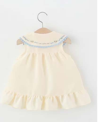 Vestido Antonella beige con cuello bordado y moños azules - foto 2