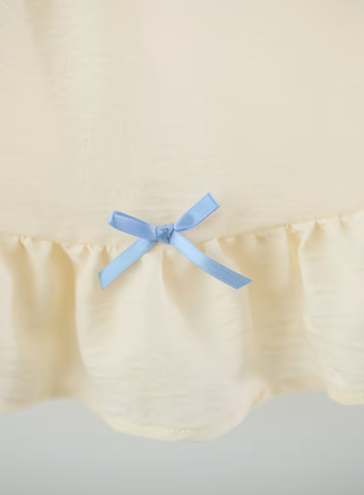 Vestido Antonella beige con cuello bordado y moños azules - foto 5